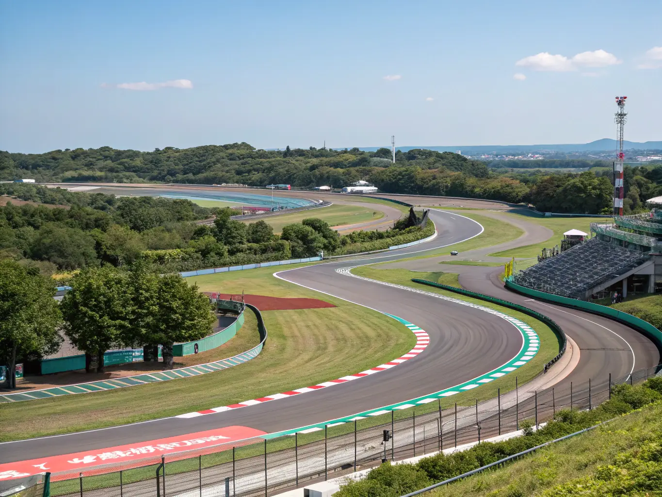 An aerial view of the Circuit de Spa-Francorchamps in Belgium, highlighting its challenging corners and picturesque setting. The image emphasizes the circuit's unique layout and natural beauty.